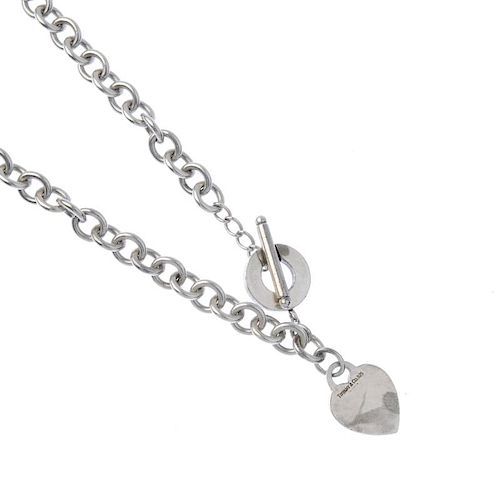TIFFANY & CO. - a silver necklace. The belcher-link chain suspending a heart-shape charm to the t-ba