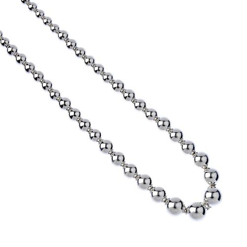 TIFFANY & CO. - a silver 'Beads' necklace. Designed as a single strand of graduated beads, to the lo