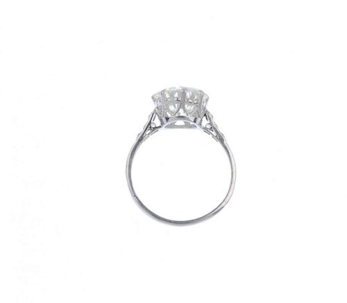 (539986-1-A) A diamond single-stone ring. The brilliant-cut diamond, to the openwork gallery and sin