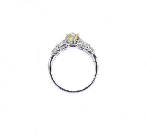 (540534-1-A) A coloured diamond and diamond dress ring. The pear-shape 'yellow' diamond, with tapere