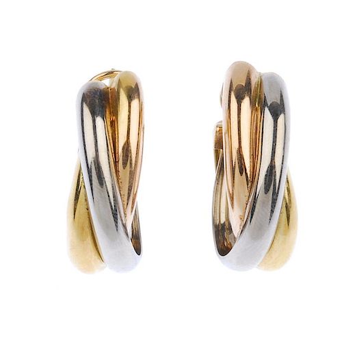 (540752-3-A) CARTIER - a pair of 'trinity' earrings. Each designed as three tri-colour, interwoven b