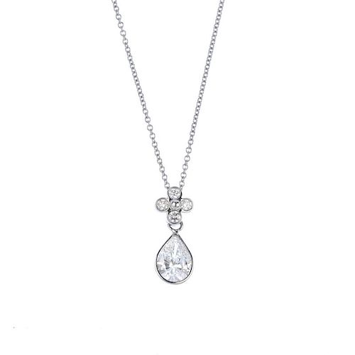 (540998-1-A) A diamond pendant. The pear-shape diamond, suspended from a brilliant-cut diamond quatr