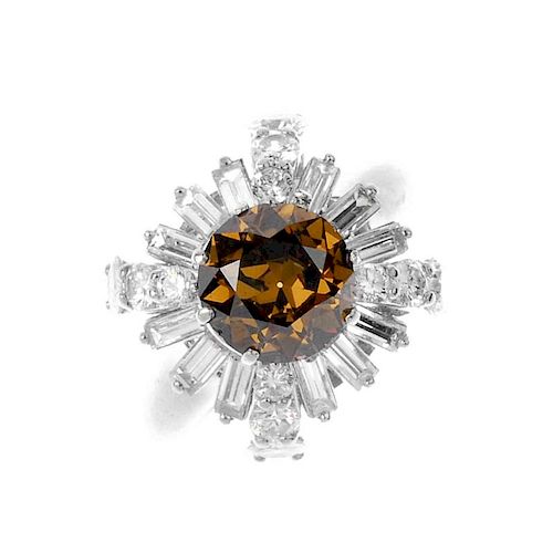 (541162-3-A) A coloured diamond and diamond dress ring. The circular-cut 'brown' diamond, within a b