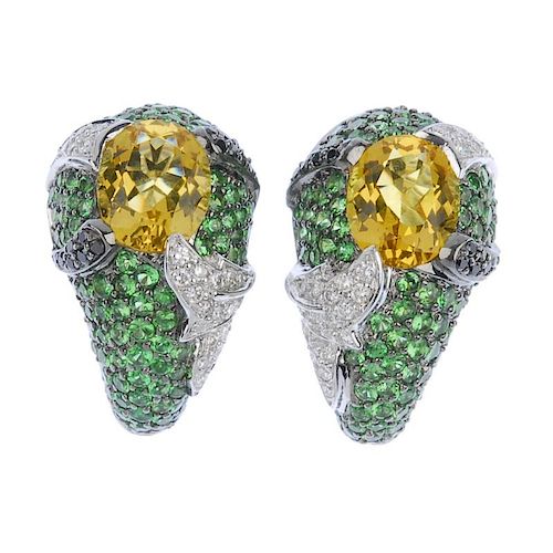 (542274-4-A) A pair of diamond and gem-set earrings. Each designed as an oval-shape citrine, inset t