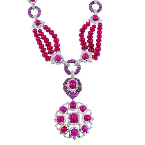 (542899-1-A) A set of ruby and diamond jewellery. The ruby bead three-row necklace, with pave-set di