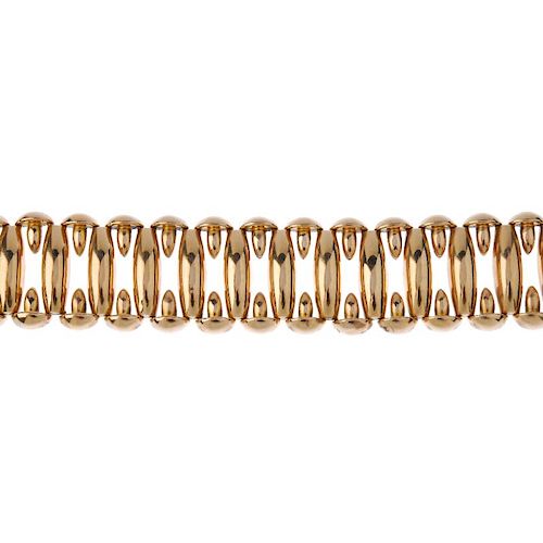 (546079-1-A) A bracelet. Comprising a series of barrel-shape links, with geometric spacers, to the c