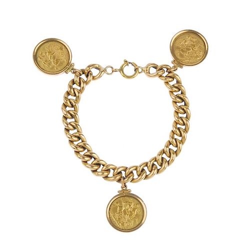 (546218-2-A) A charm bracelet and five sovereigns. The curb-link bracelet, with later spring ring cl