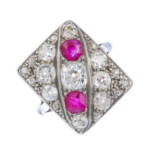 (137392) A diamond and ruby dress ring. Designed as a rectangular-shape panel of old-cut diamonds an