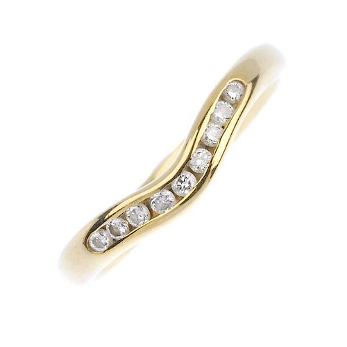 (161740) An 18ct gold diamond chevron ring. Designed as a curved channel of brilliant-cut diamonds t