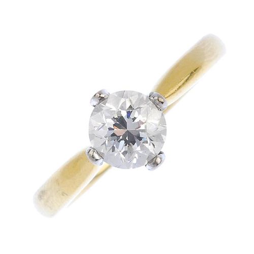 (161740) An 18ct gold diamond single-stone ring. The brilliant-cut diamond to the tapered shoulders