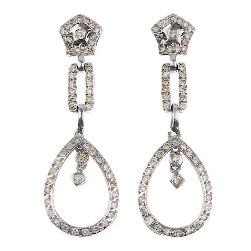 (176761) A pair of pave-set diamond ear pendants. Each designed as a pear-shape dropper to the chann