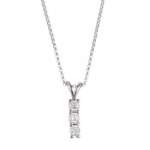 (57564) An 18ct gold diamond three-stone pendant. Designed as a line of three brilliant-cut diamonds