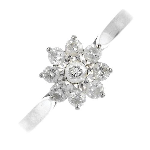 (57565) An 18ct gold diamond cluster ring. Of floral design, the brilliant-cut diamond cluster to th