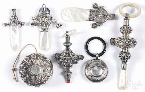 Silver and silver plated children's toys, 19th/20th c., to include three whistles, three rattles