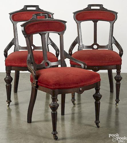 Set of six Victorian dining chairs, ca. 1900, with red upholstery.
