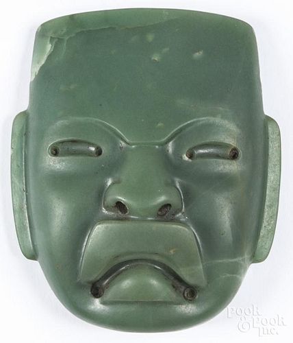 South American carved hardstone plaque of a mask of a warrior, 6 1/4'' h.
