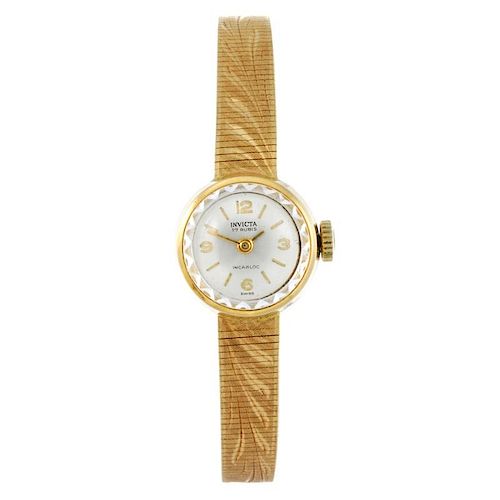 INVICTA - a lady's bracelet watch. Yellow metal case, stamped 18k 0750. Signed manual wind movement.