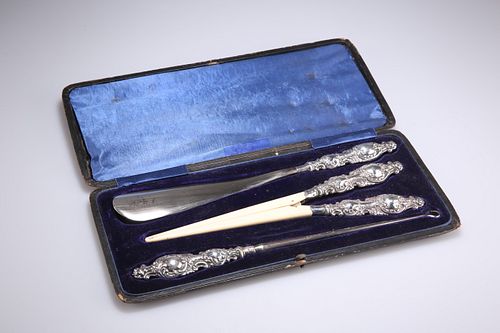 A VICTORIAN SILVER-HANDLED SHOE-HORN, GLOVE-STRETCHER AND B