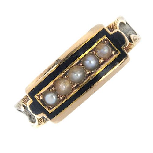 A mid Victorian 15ct gold split pearl and enamel memorial ring. The split pearl line, within a black