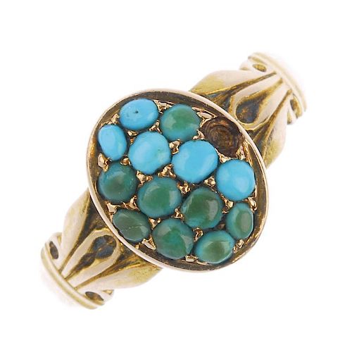 A late Victorian 15ct gold turquoise ring. The oval-shape turquoise cabochon cluster, to the scrolli