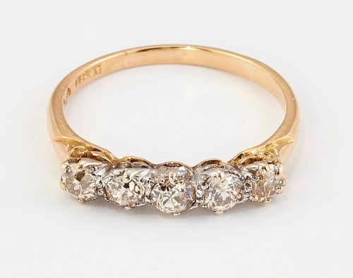 A DIAMOND FIVE-STONE RING, old-cut diamonds above a carved 