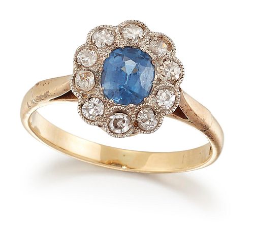 AN 18CT GOLD SAPPHIRE AND DIAMOND CLUSTER RING, an oval-cut