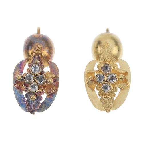 A pair of late Victorian paste earrings. Each designed as a colourless gem quatrefoil, atop a textur