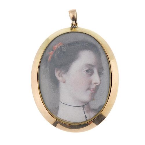 An early 20th century 15ct gold portrait pendant. The glazed panel, within a plain border, to the ta