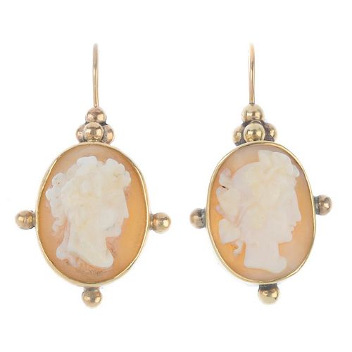 A pair of early 20th century 9ct gold shell cameo ear pendants. Each designed as an oval-shape shell