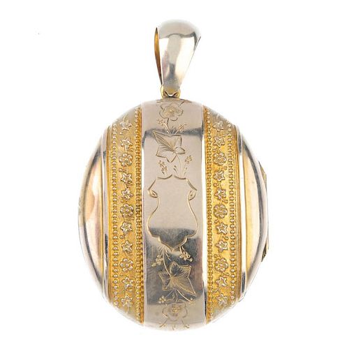 A gold plated locket and scarf clip. The locket of oval outline, the parallel embossed floral border