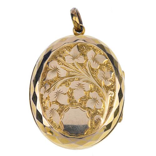 A late Victorian locket. The front designed as a floral initial monogram, the reverse a foliate moti