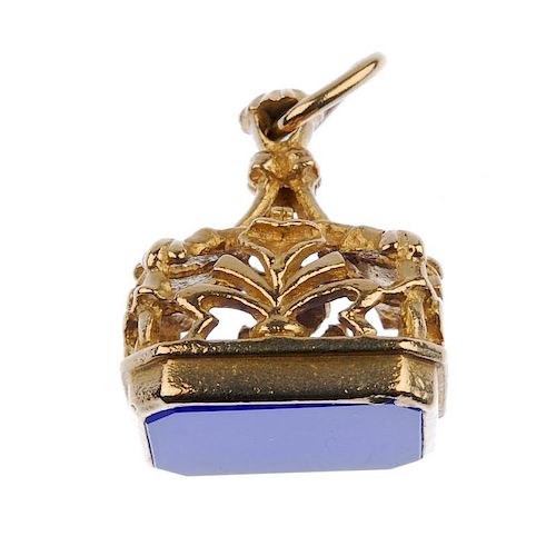 A 9ct gold gem-set fob. Designed as a rectangular dyed blue chalcedony fob to the openwork foliate g
