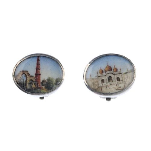 A pair of hand painted international ear clips. Designed as oval panels, hand painted with two diffe