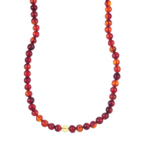 A natural Burmese blood amber necklace. Comprising 110 amber beads measuring 6 to 8mm, of mostly dar