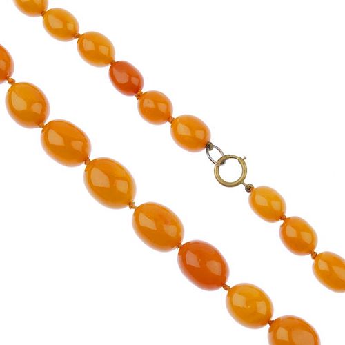 A natural amber necklace. Comprising forty-five oval-shape, graduated natural amber beads measuring