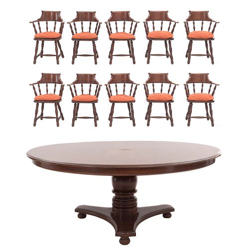 Comedor. SXX. Elaborado en madera. Consta de mesa y 10 sillones. Mesa con cubierta circular, fuste a manera de jarrón.
