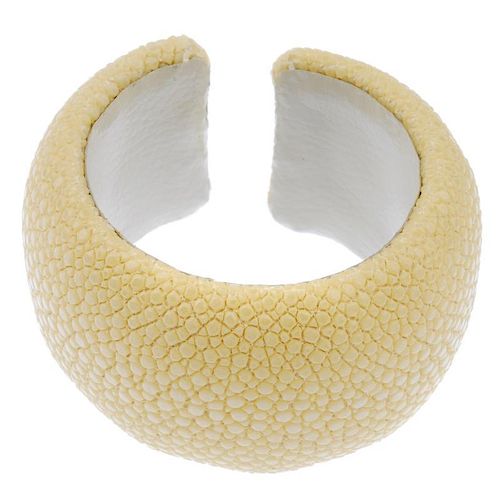 A dyed yellow stingray cuff. Signed Maximos. Inner diameter 5.1cms. Width 4cms. <br><br>Overall cond