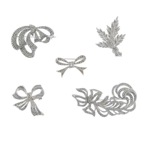 A selection of marcasite jewellery. Including a brooch designed as a feather with a bow to one end,