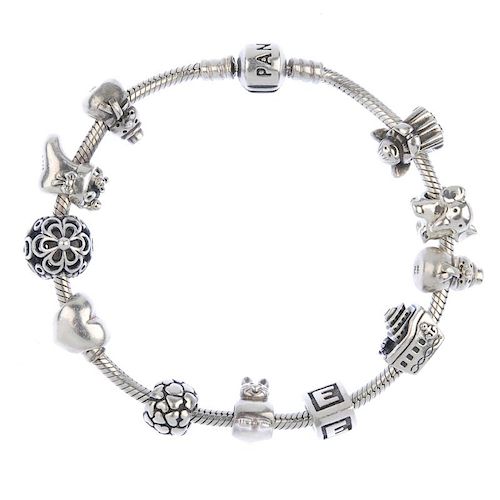 PANDORA - a charm bracelet. With eleven Pandora charms to include an elephant and an angel. . With m