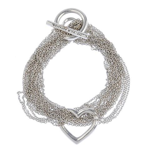 TIFFANY & CO. - a bracelet. Designed as an open heart with multiple strands of belcher-link chain to