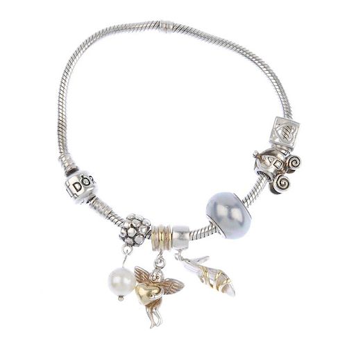 PANDORA - a charm bracelet with various designer and non designer charms. Including a Pandora cultur