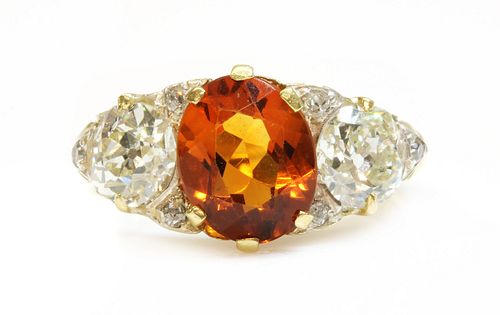 A late Victorian citrine and diamond boat shaped carved head ring,