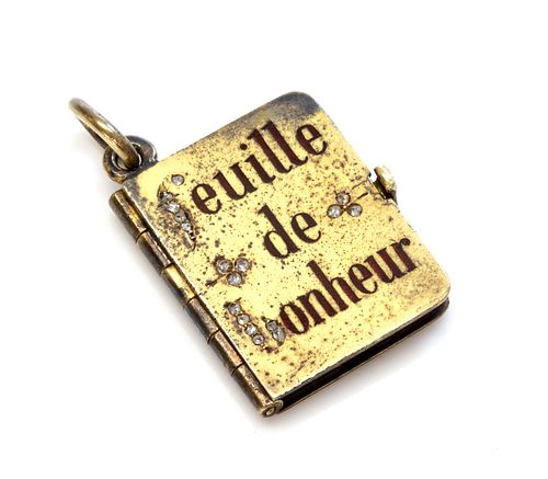 An Austrian gold diamond and enamel set book form locket, c.1900,