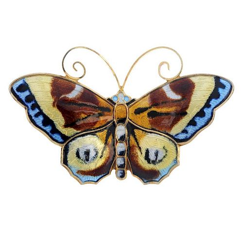 DAVID ANDERSEN - an enamel butterfly brooch. The enamel wings in pale blue, black, yellow, brown and