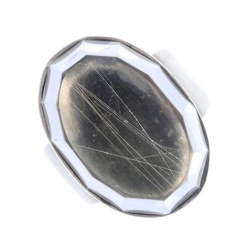 O. U. BOHLIN - a rutilated quartz ring. The fancy-cut rutilated quartz, collet-set and set to a post