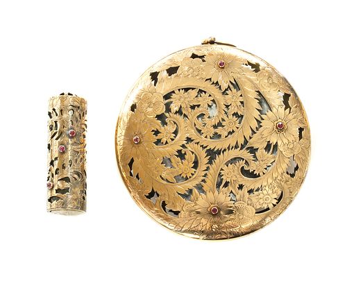 A silver and gold ruby set compact and lipstick holder, by Boucheron,
