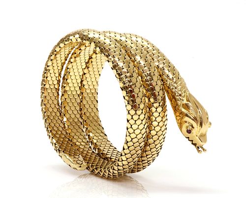 An Italian ruby set coiled snake style flexible bangle, c.1950,
