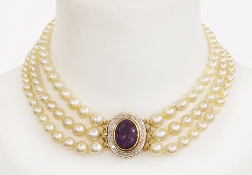 A three row graduated cultured pearl necklace with an amethyst and diamond cluster clasp,