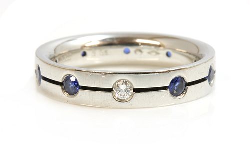A Swiss platinum diamond and sapphire set band ring, by Furrer-Jacot,