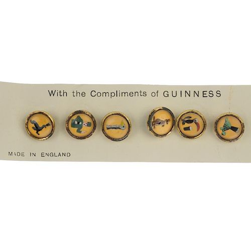 A set of six dress studs. Of circular outline, each depicting a character from the Guinness advertis